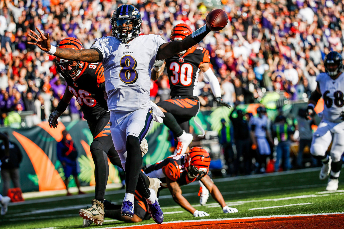 Lamar Jackson scores on a long touchdown run against the Bengals
